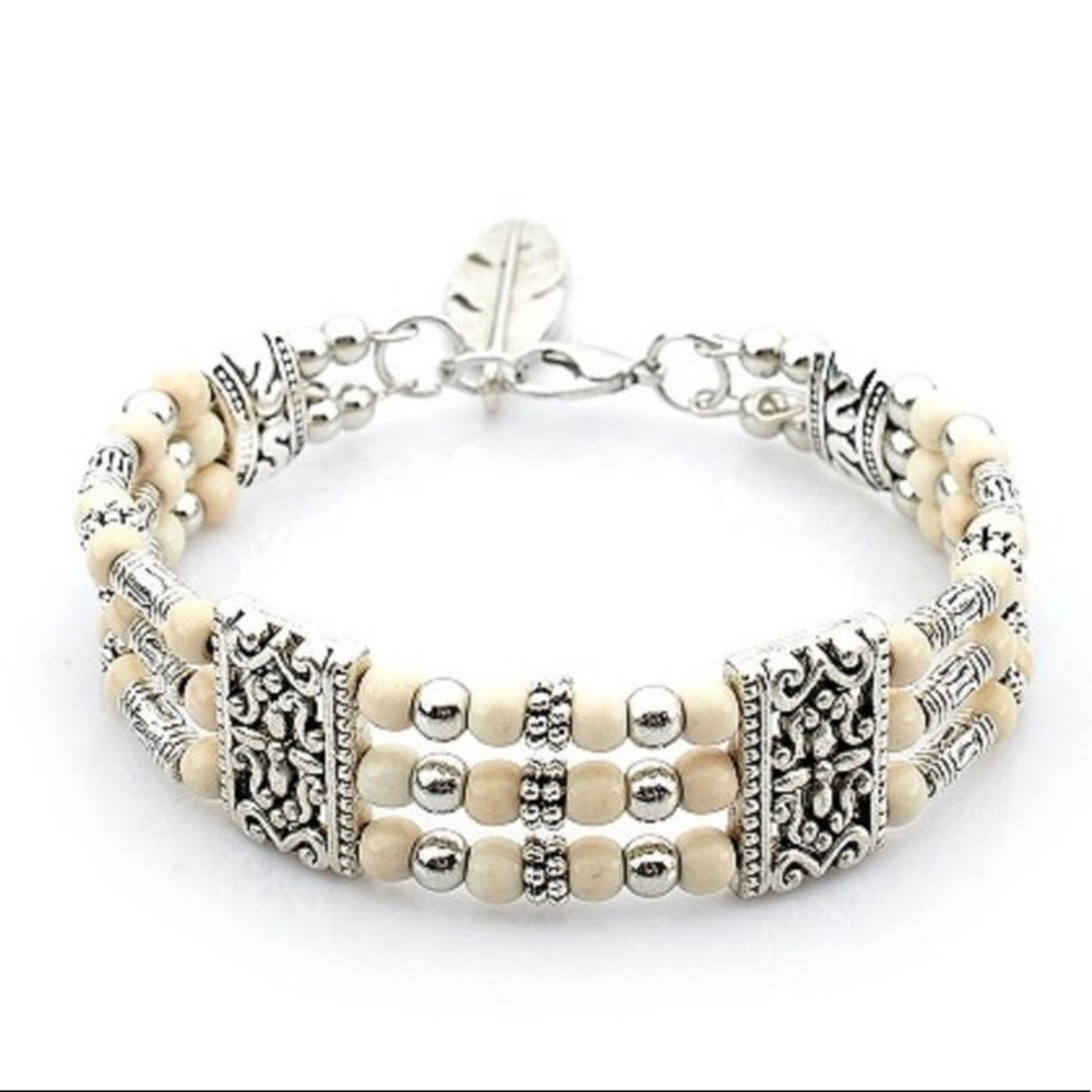 NWOTWhite bohemian style bracket alloy
